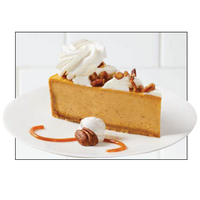 Slice of pumpkin cheesecake with pecans