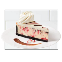 Slice of cheesecake with swirl of whipped cream - cake16-01
