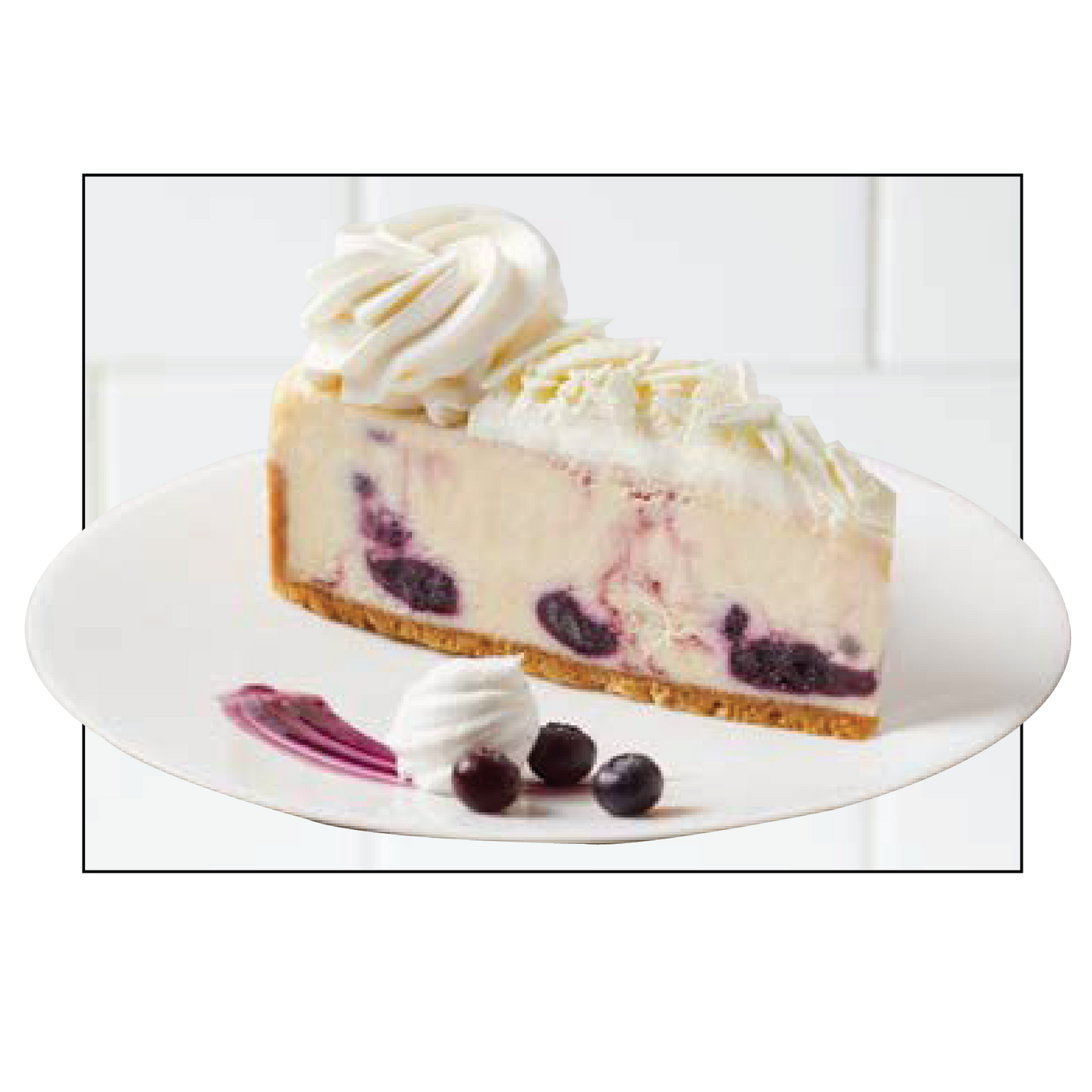 Slice of blueberry cheesecake with whipped cream